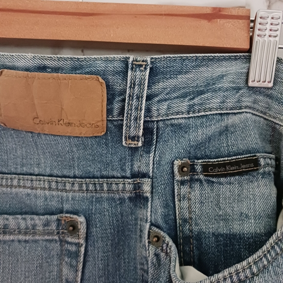 Calvin Klein • Men's Light/Medium Wash Distressed Bootcut Denim Jeans - Picture 3 of 15